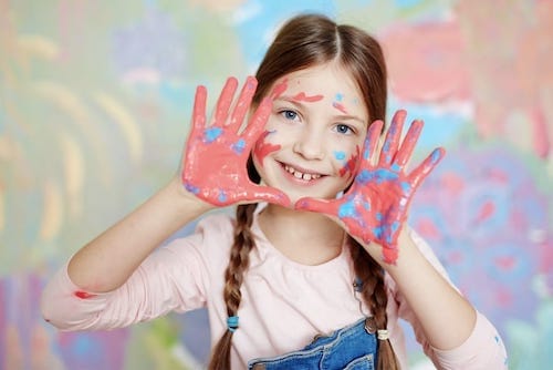 child finger painting