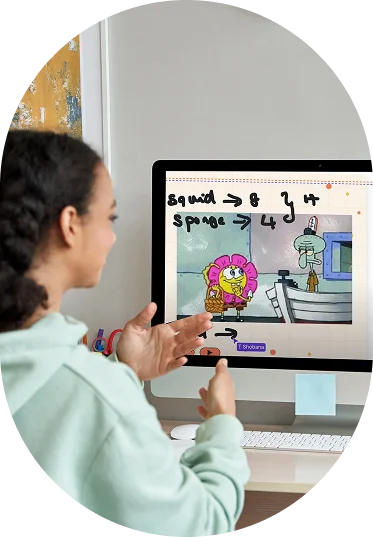 cheerful-elementary-mixed-race-siblings-sitting-by-table-living-room-watching-funny-online-movie-video-having-fun-leisure 3 (1)